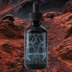 A dark dropper bottle labeled "RECOVERY" on a rocky, red terrain.
